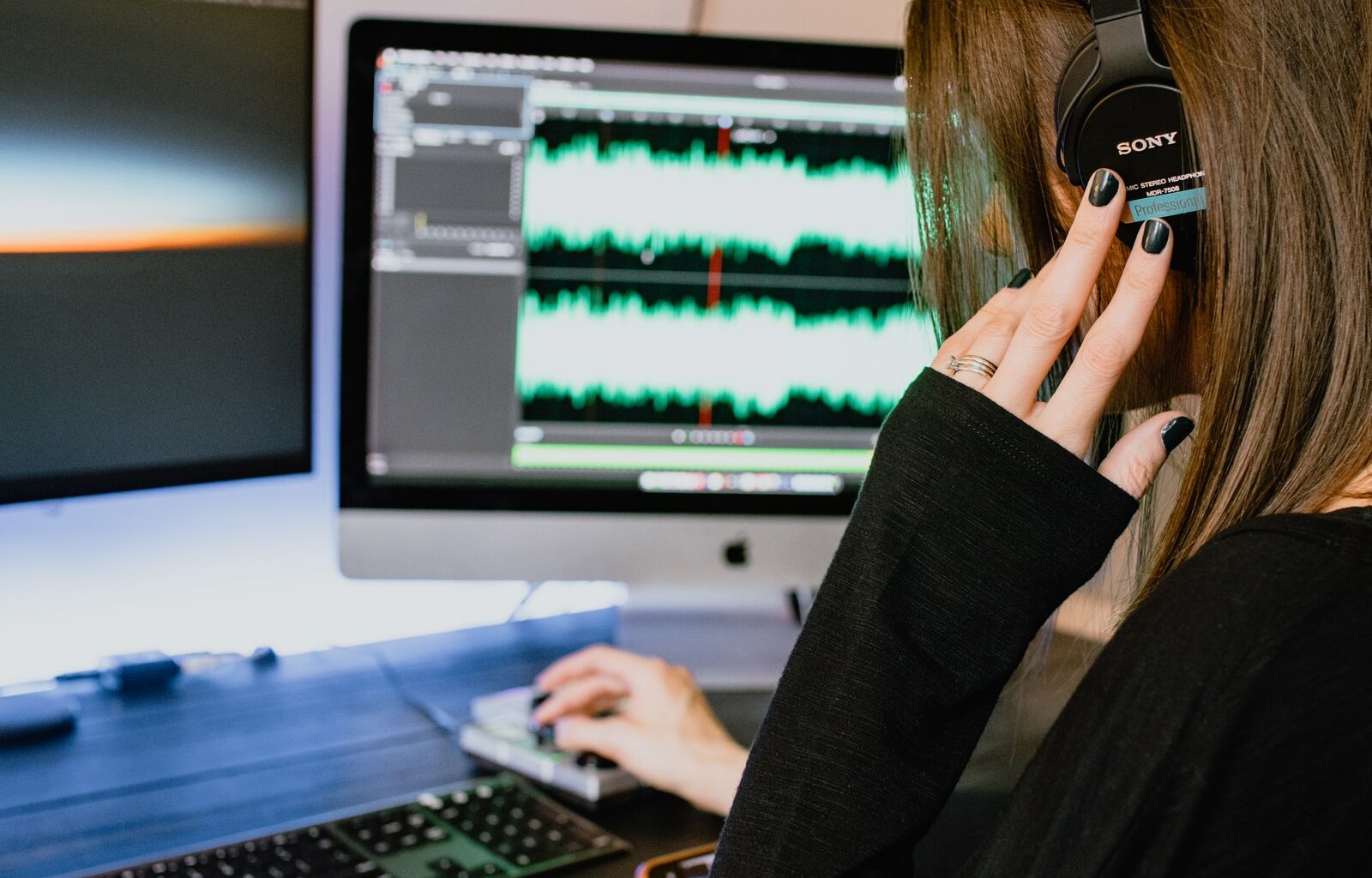 woman in black long sleeve shirt using black laptop computer