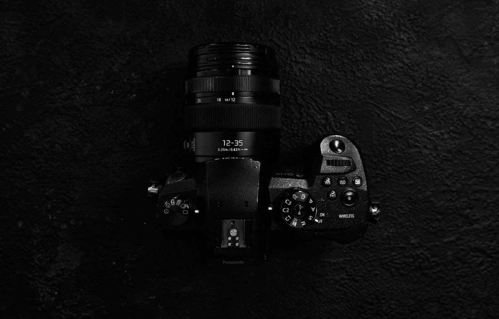 black sony dslr camera on black surface