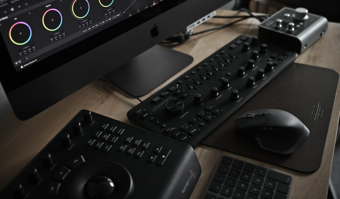 wireless computer mouse beside DJ controller and iMac