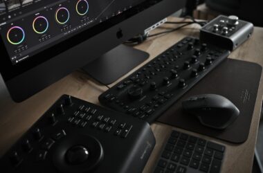 wireless computer mouse beside DJ controller and iMac
