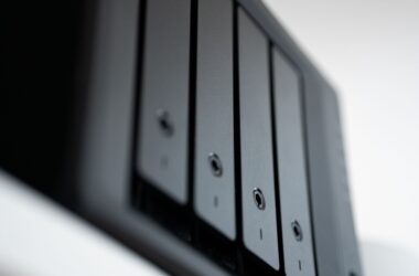 Close-up of a black NAS unit with four drive trays