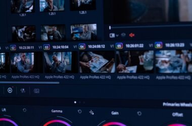 Close-up of a monitor showing a video editing interface with color grading tools