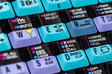 macro of colour-coded NLE keycaps: SOURCE VIEWER, EXPORT PROJECT, NODE