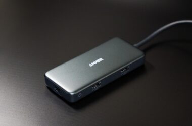 Anker USB-C dock on a black desk, cable running off