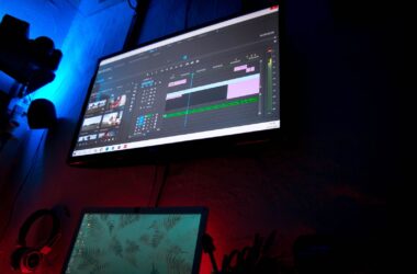 display as hero in a dark room, editing timeline, red-blue practicals
