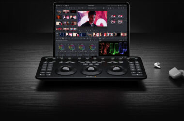 Micro Color Panel three trackballs on black wood, laptop running Resolve