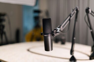 Shure SM7B broadcast dynamic on boom arm in dim studio room