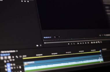 Close-up of dark Premiere timeline, program monitor, timecode, video and audio tracks