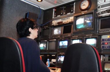 Wall of monitors inside a television broadcast control room