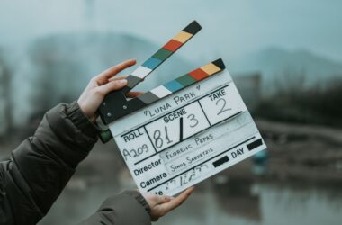 Hands holding a film clapperboard