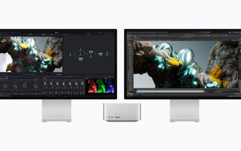 Apple Mac Studio between two Studio Displays, one showing DaVinci Resolve Studio color page, the other Houdini