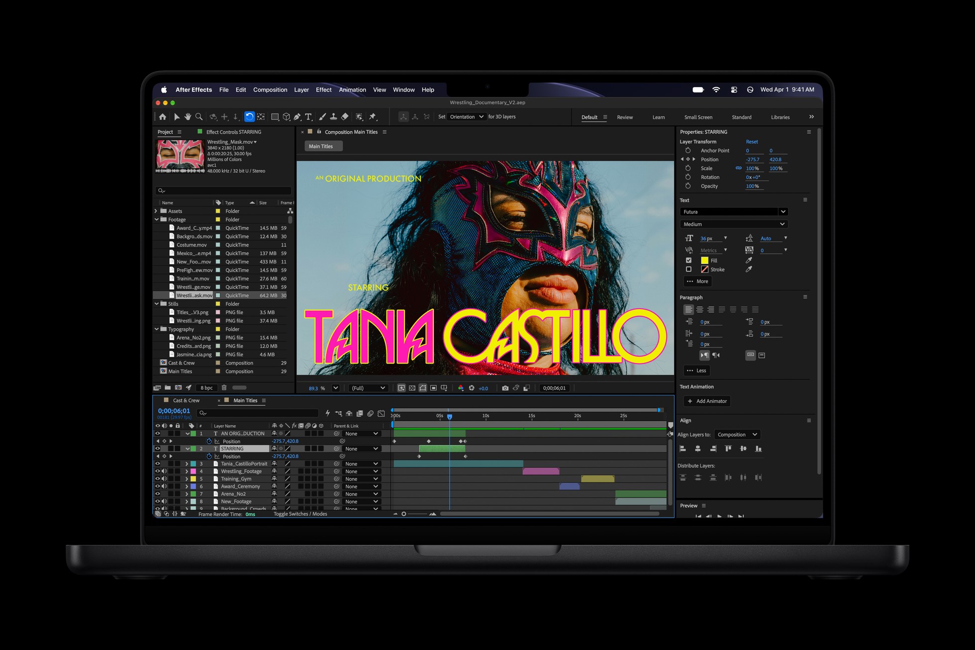 A 14-inch MacBook Pro M6 in space black with an After Effects title composition on screen
