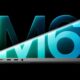 A partly open 14-inch MacBook Pro seen from the side against a glowing M6 logo